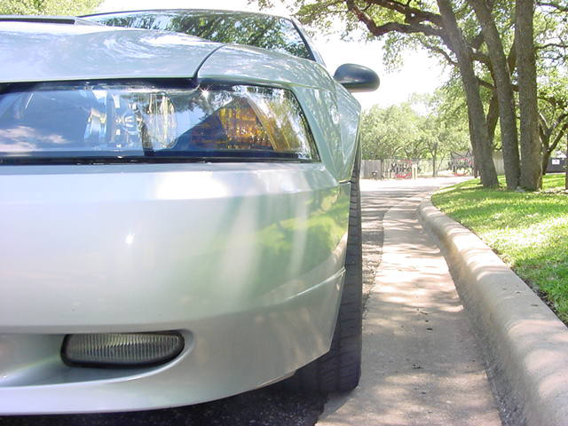 1999 Ford Mustang front corner, showing headlight and bumper