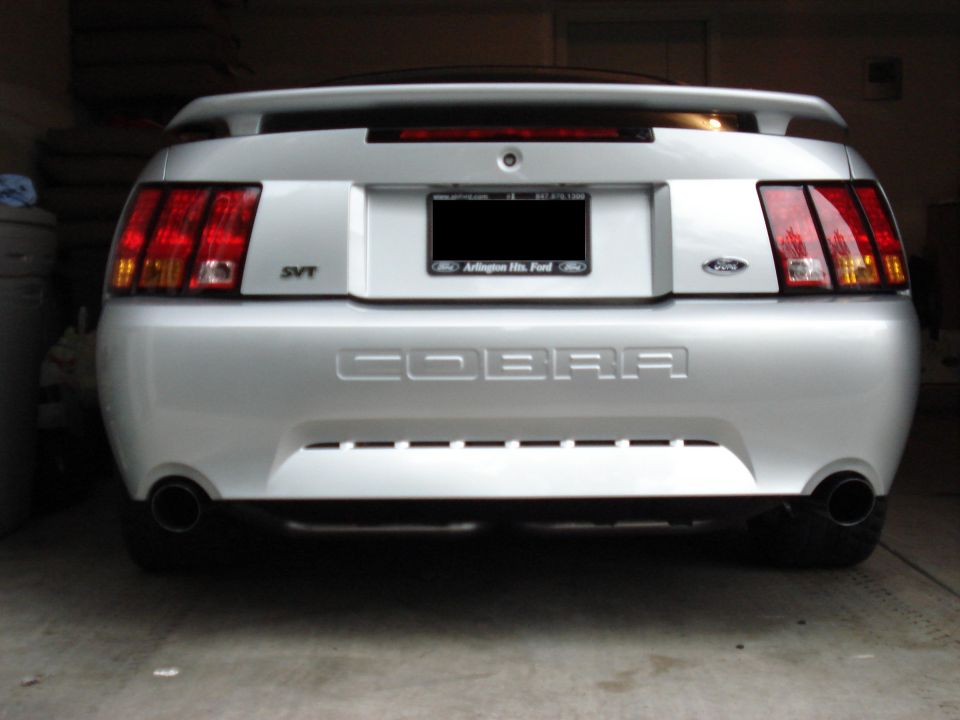 Silver Ford Mustang Cobra SVT rear view with COBRA embossed on trunk