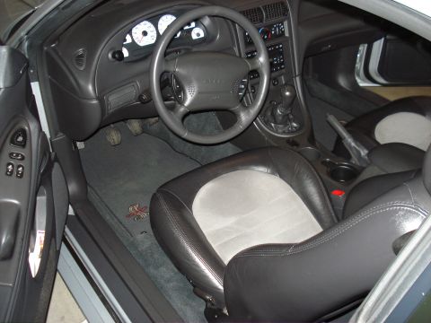 1998 Ford Taurus - Interior of a 1999 Ford Mustang Cobra, leather and suede seats and a manual transmission.