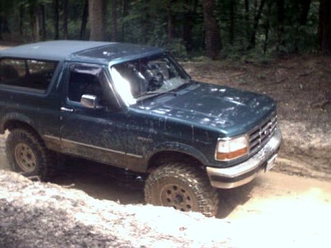 1996 Ford Bronco - This 1996 Ford Bronco is navigating a muddy off-road path.