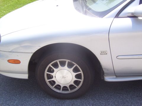 1998 Ford Taurus - Here are a few dents and scratches which I am going to have fixed as soon as i get a paint job.