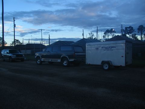 1995 Ford C-350 (Centurion Conversions) - Ford F-Series truck and trailer parked near a field at dusk.