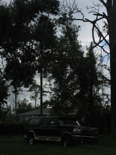 1995 Ford C-350 (Centurion Conversions) - Black Ford Bronco SUV with two-tone lower body trim parked outdoors.