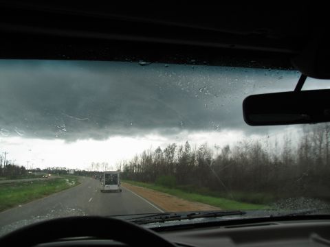 1995 Ford C-350 (Centurion Conversions) - Driving through a storm with heavy clouds and rain on the windshield.