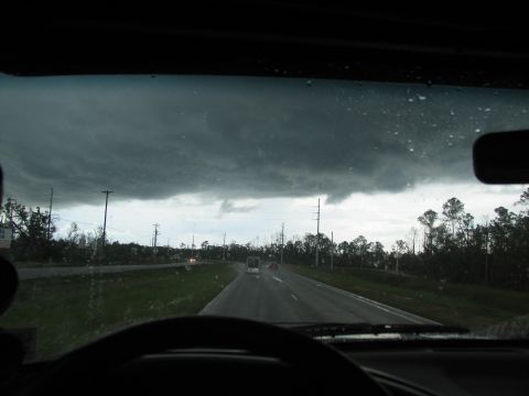 1995 Ford C-350 (Centurion Conversions) - Driving through a storm with heavy clouds overhead and rain on the windshield.