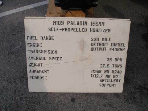 1998 Ford Crown Victoria - Stenciled white information placard for the M109 Paladin 155mm self-propelled howitzer, listing a 220-mile fuel range, Detroit Diesel engin…