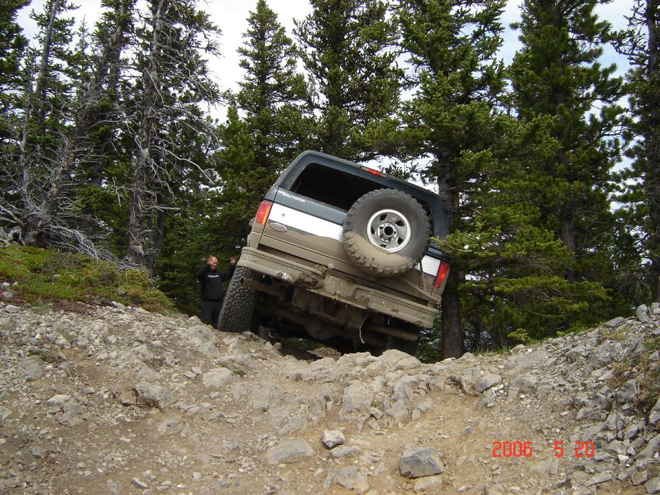 1995 Ford Bronco rear view, off-roading on a rocky trail