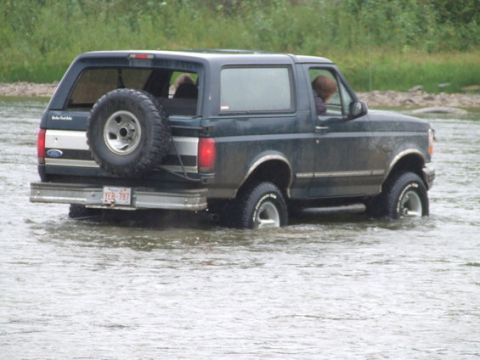 1995 Ford Bronco - This 1995 Ford Bronco navigates through shallow water, its robust off-road capability.