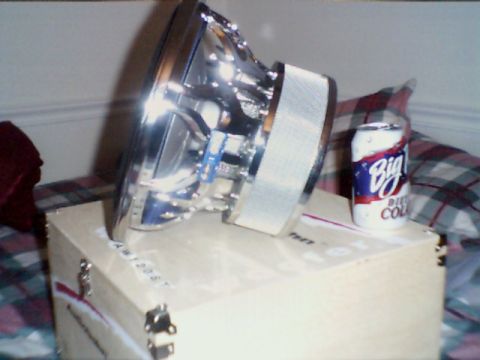 1998 Ford Taurus - A car subwoofer and a can of Big Diet Cola sit on top of a cardboard box.
