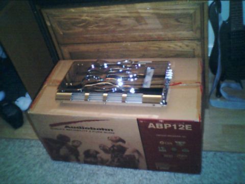 1998 Ford Taurus - An Audiobahn ABP12E car amplifier is shown resting on its original packaging.