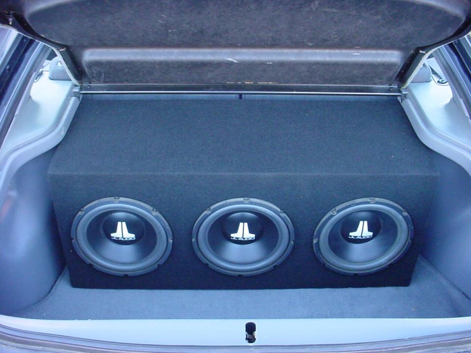 Trunk with three JL Audio subwoofers in a custom enclosure