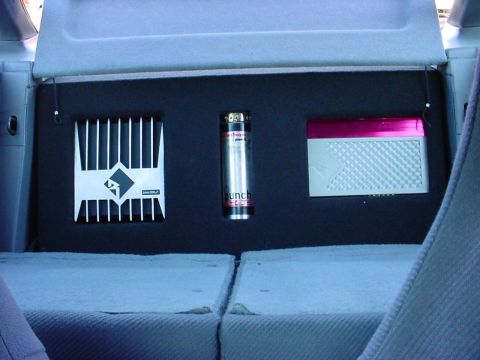 1994 Ford Probe - Custom car audio components including an amplifier, capacitor, and crossover are installed.