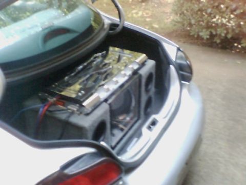 1998 Ford Taurus - Aftermarket audio equipment installed in the trunk of a car.