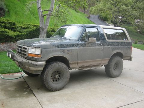 1995 Ford Bronco - This 1995 Ford Bronco is shown in a 3/4 front view, covered in mud and an aftermarket bumper.