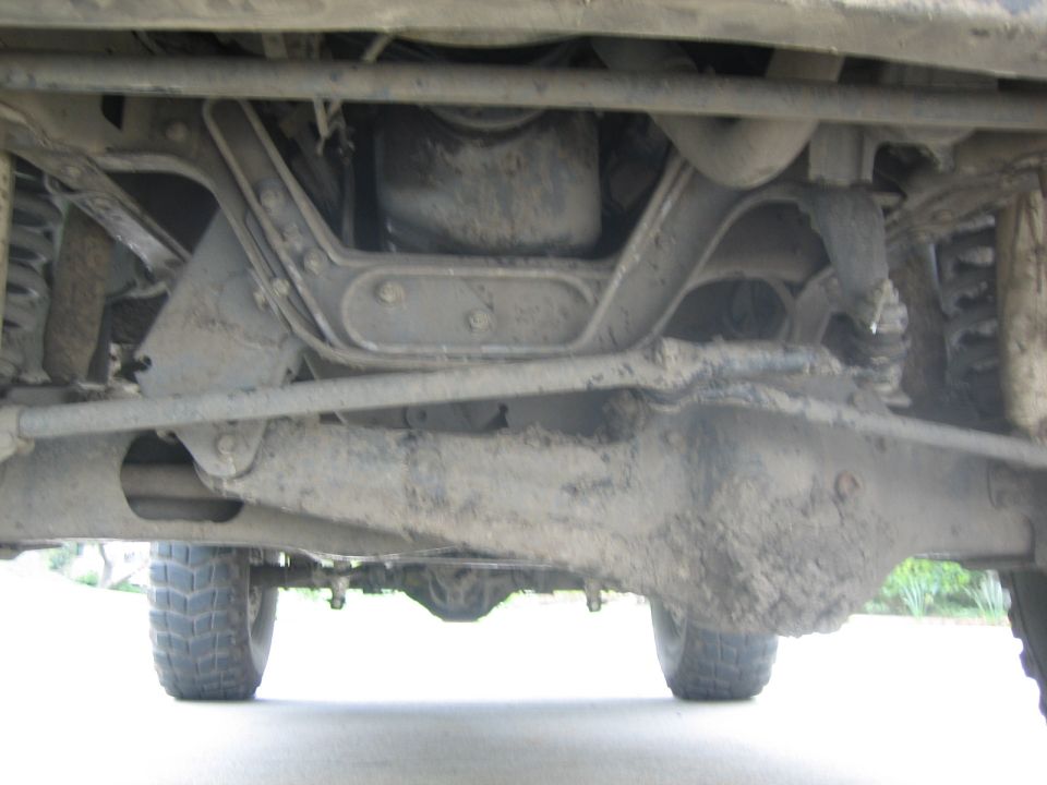 Undercarriage view of a 1995 Ford Bronco, showing suspension and drivetrain components