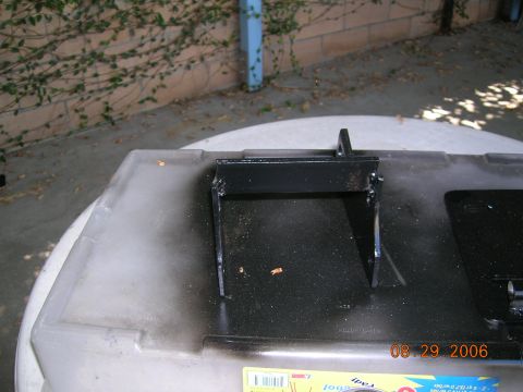 1985 Ford Bronco - Metal bracket mounted on a plastic container, dated August 29, 2006.