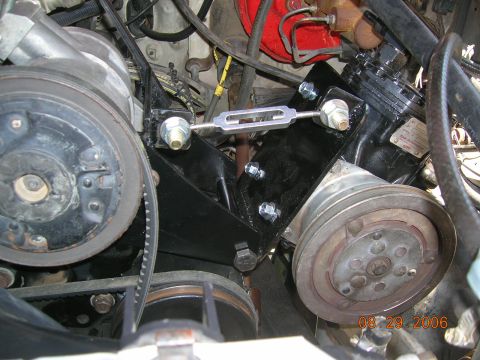 1985 Ford Bronco - Close-up view of engine components, including a compressor and various pulleys and belts, with a date stamp visible.