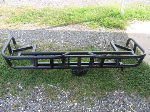 1999 Toyota Tacoma - Aftermarket rear bumper assembly with integrated tire carrier and hitch receiver.