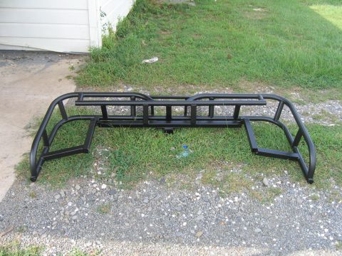 1999 Toyota Tacoma - This is a black metal truck bed rack with side rails and a ladder rack section.