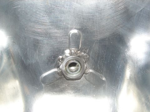 1996 Ford Bronco - Close-up of a metal component a bolt and wing nuts, with the Supermotors.net logo in the corner.