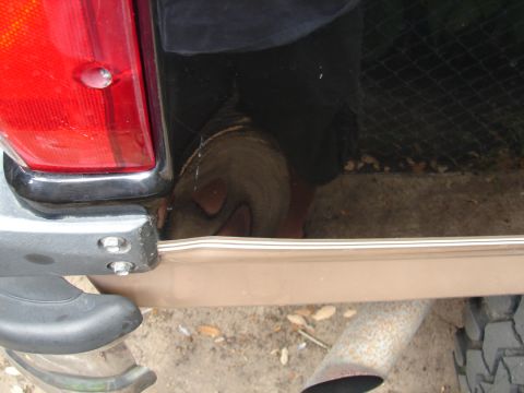 1996 Ford Bronco - Damage caused by having a 36" tire mounted to the stock carrier.