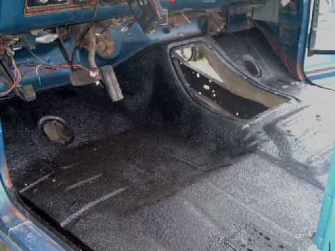 1984 Ford Bronco - The textured floor of a vehicle's interior, showing the application of a protective coating.
