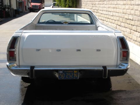 1973 Ford Ranchero - The rear of a white 1972 Ford Ranchero is shown, with a chrome bumper and California license plate.