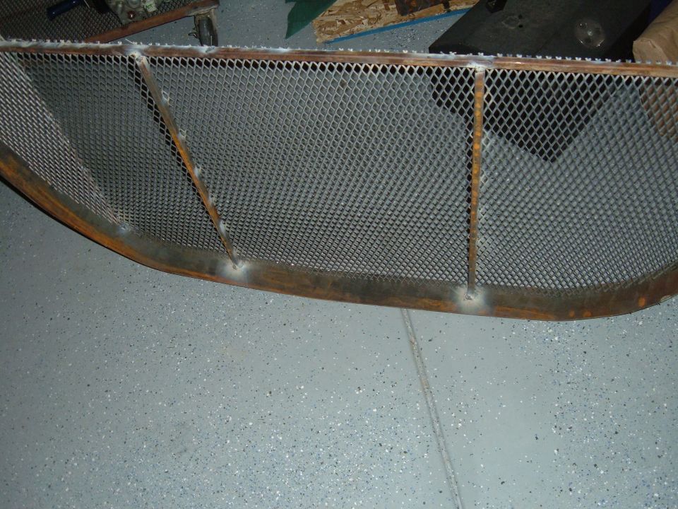 Custom metal grille with diamond pattern mesh and welded supports