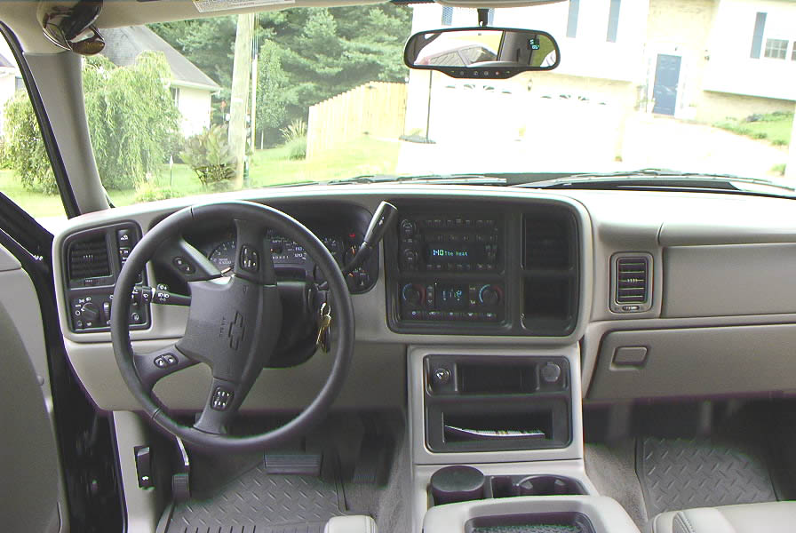 Interior view of Chevrolet truck dashboard and steering wheel with Chevrolet logo