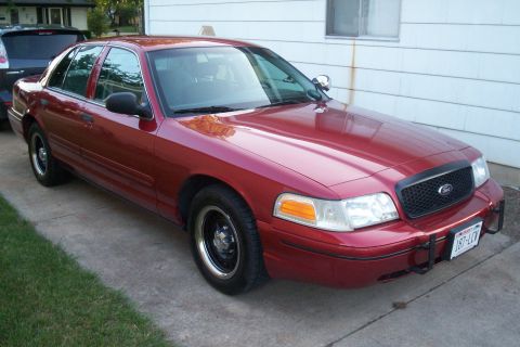 2001 Ford Crown Victoria - This 2001 Ford Crown Victoria is parked on a concrete driveway next to a house.