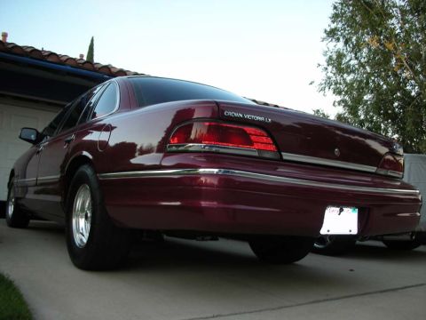 1992 Ford Crown Victoria - Rear view of a maroon Crown Victoria LX sedan parked in a driveway.