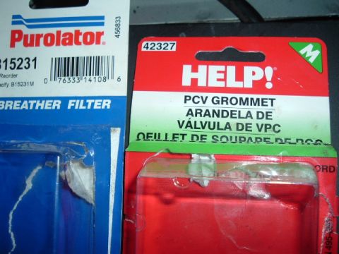 1989 Ford Crown Victoria LTD - Two automotive parts are shown in their retail packaging, a Purolator breather filter and a HELP! PCV grommet.