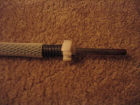 1995 Ford Bronco - This is the rod once it is removed, the spring on the left is the one that makes the cover roll itself up, it works just like a small versi…