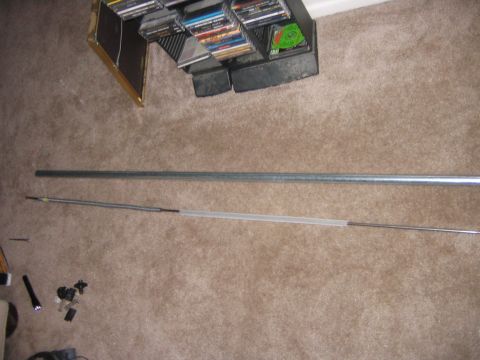 1995 Ford Bronco - Here is the rod sitting beside the outer tube. The spring is held on to the rod with a small rivet, which luckily was in good shape.