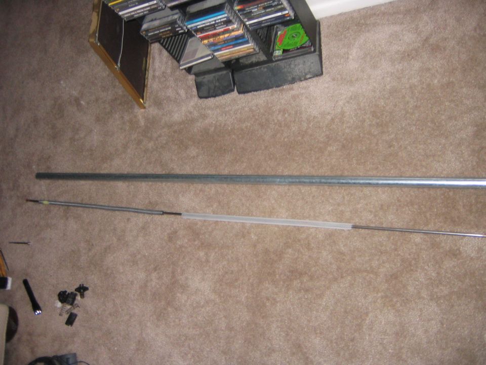 Here is the rod sitting beside the outer tube. The spring is held on to the rod with a small rivet, which luckily was in good shape.