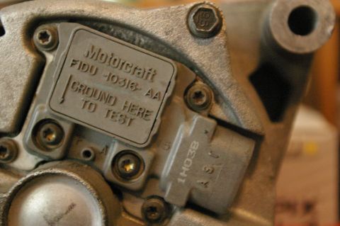 1986 Ford Bronco - Close-up of a Motorcraft alternator part, showing "GROUND HERE TO TEST" instructions.
