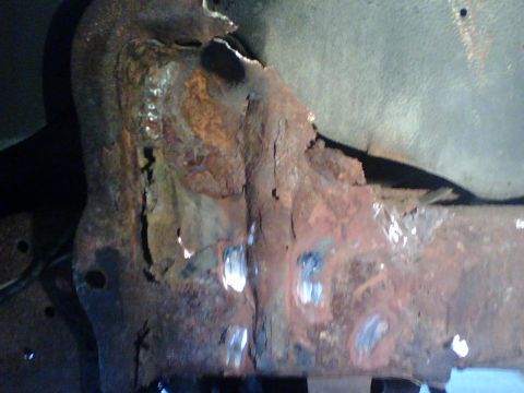 1989 Ford Bronco - I had to grind off the rivetheads of what was left of the mount after cutting the shocks off and removing coil.
