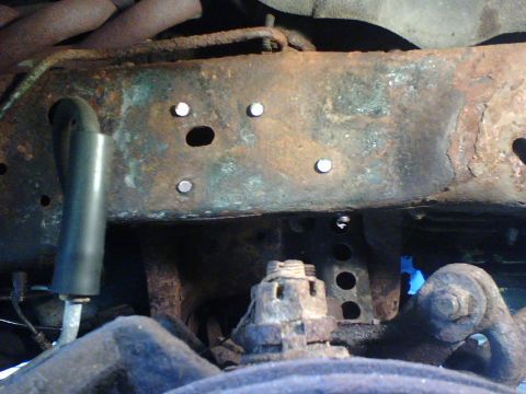 1989 Ford Bronco - once the rivet heads (6) were ground off with the 4-1/2 in grinder and mount removed I still had to use a OX torch to heat and punch the ri…