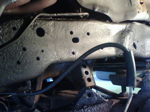 1989 Ford Bronco - With the frame and holes exposed I ground, primed, painted and undercoated it.