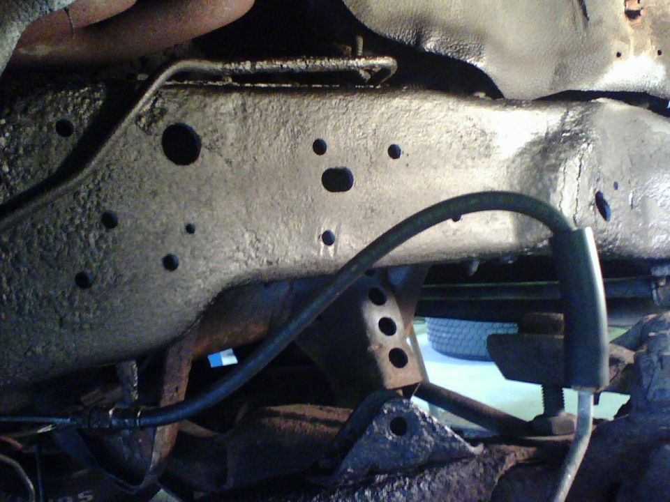 With the frame and holes exposed I ground, primed, painted and undercoated it.