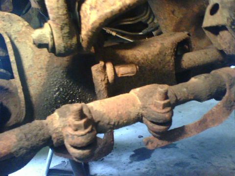 1989 Ford Bronco - At center of photo a broken lower front shock bolt . Needed replacement.