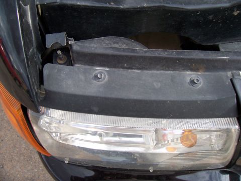 2003 Ford Ranger - Close-up of the front headlight assembly on a 2003 Ford Ranger.