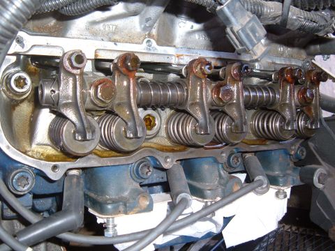 1985 Ford Bronco II - Close-up view of an engine's valve train, showing rocker arms and springs.