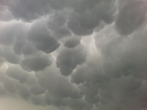 1989 Ford Bronco - Mammatus clouds are seen in the sky, with a Supermotors logo in the corner.