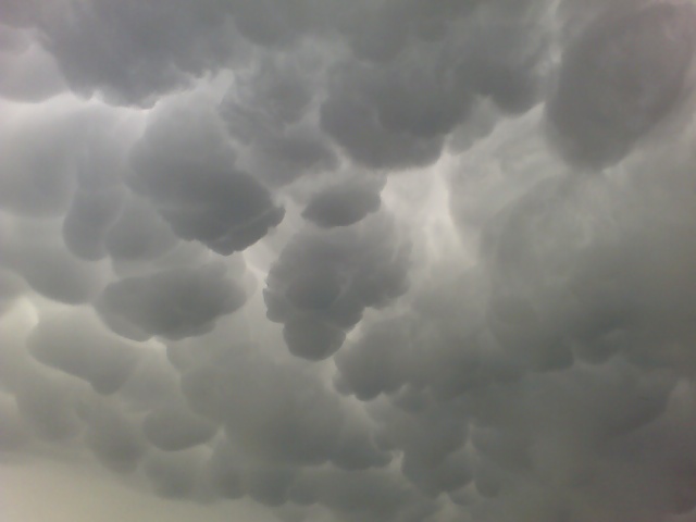 Mammatus clouds with Supermotors logo