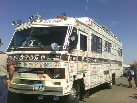 1989 Ford Bronco - This custom RV is covered in numerous stickers, including text on the windshield and a novelty license plate.