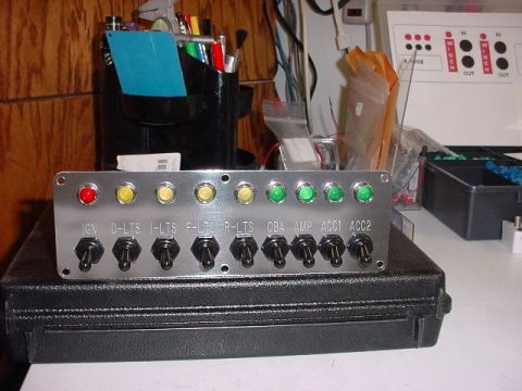1992 Toyota Tacoma - Custom switch panel with toggle switches and indicator lights for various vehicle functions.