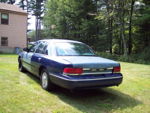 2001 Ford Crown Victoria - This Ford Crown Victoria has a two-tone paint job, with the rear half a lighter gray than the front blue half.
