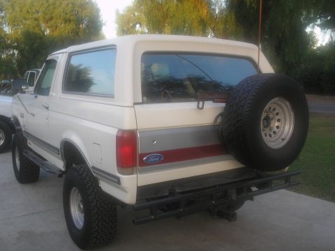 1990 Ford Bronco - This 1990 Ford Bronco is shown from the rear, a spare tire mounted on the tailgate and a tow hitch.