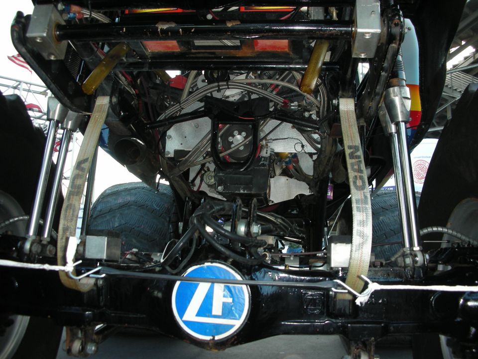 Underside rear of a race car showing a blue ZF transmission and suspension
